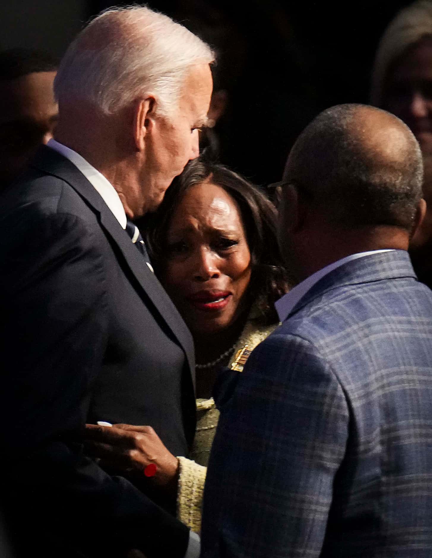 President Joe Biden consoles Sondra Johnson, daughter in law of former U.S. Rep. Eddie...