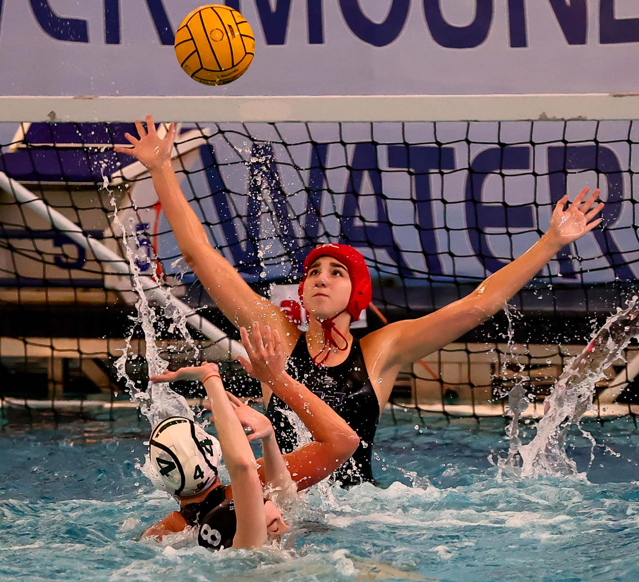 Hebron's goal keeper Savana Slaughter (1) stops a shot against Southlake Carroll's Maile...