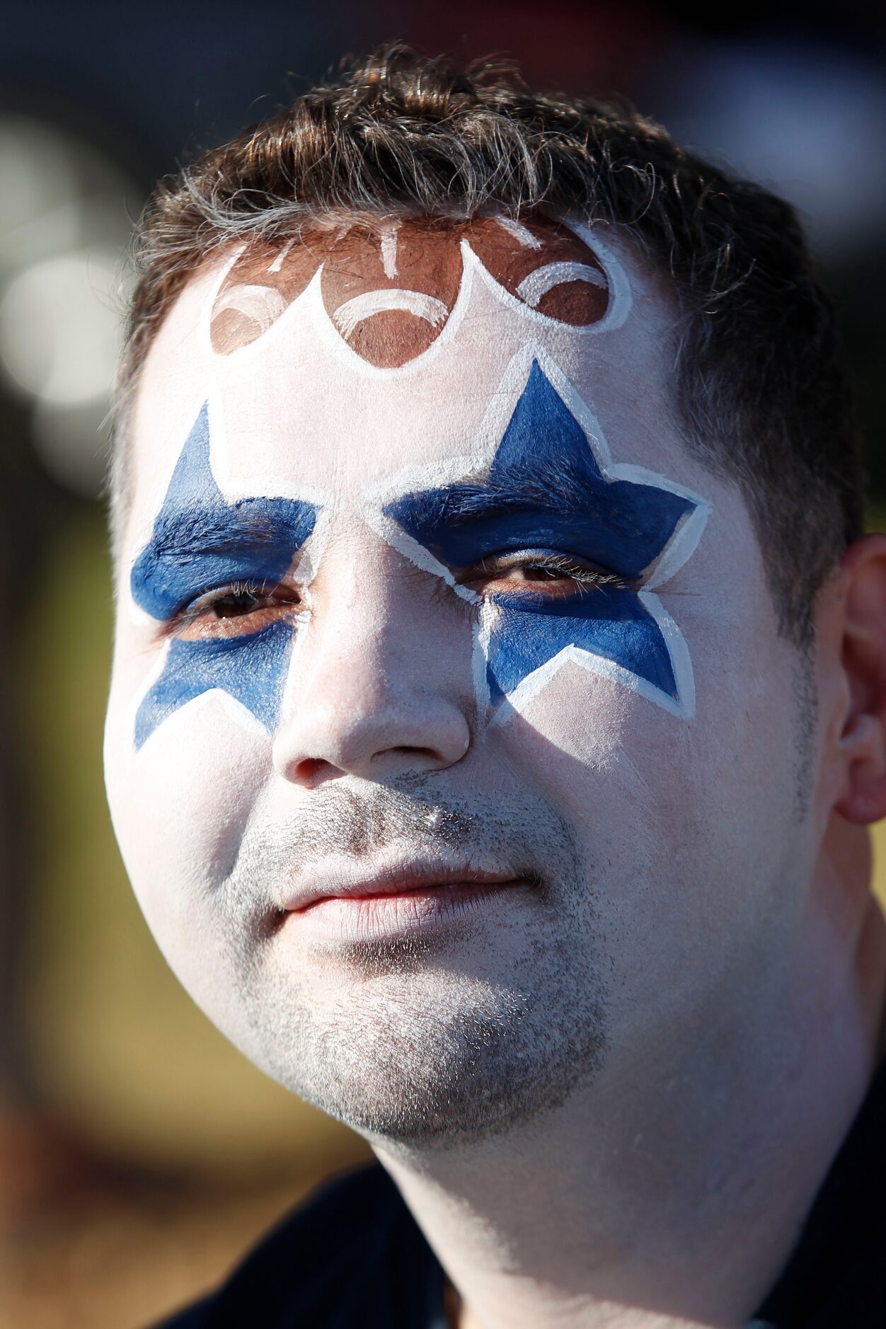 Josh Sanchez of  Grand Prairie, Texas shows of his face painting prior to the Dallas...