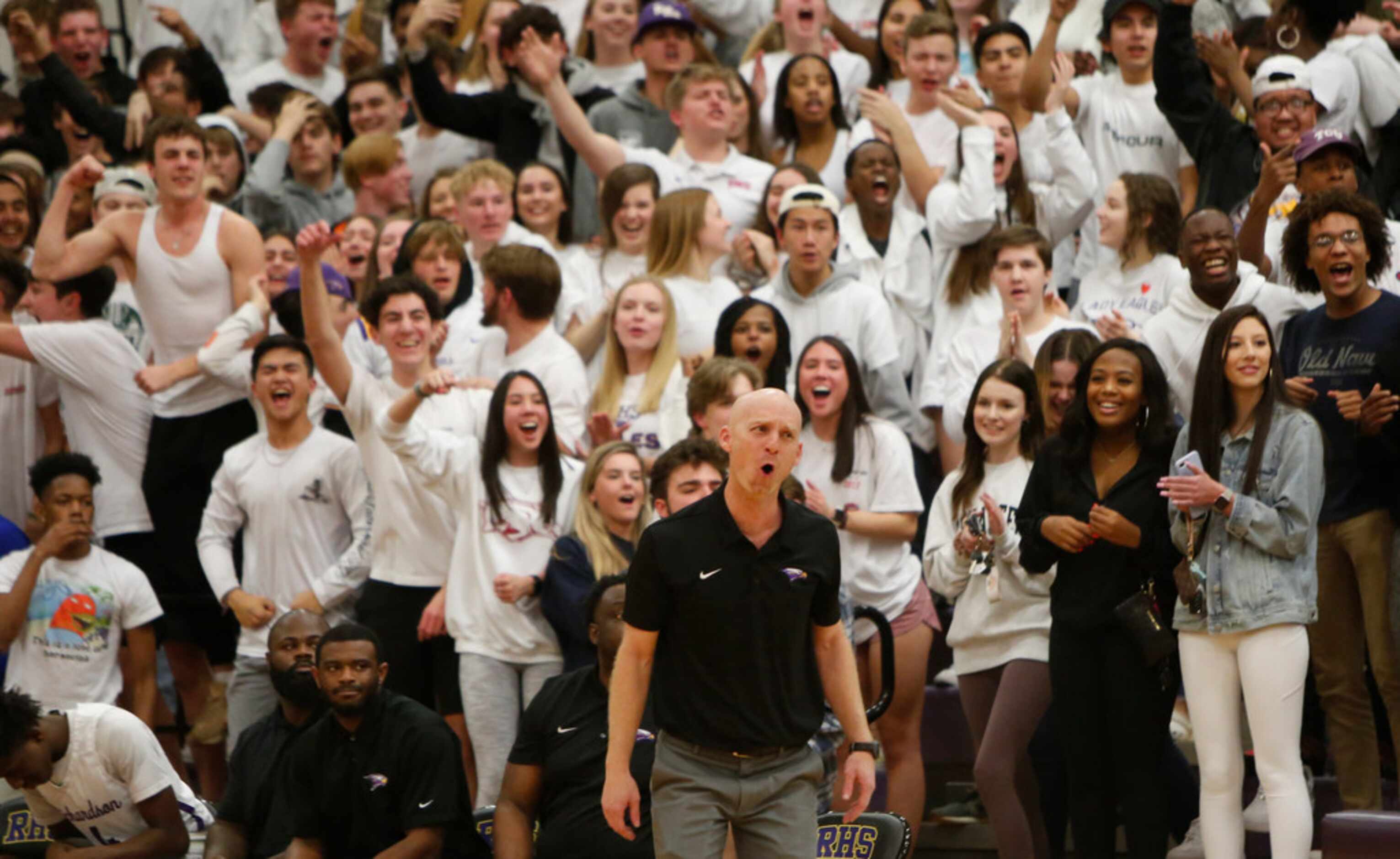 Richardson head coach Kevin Lawson reacts along with a rowdy student section after...