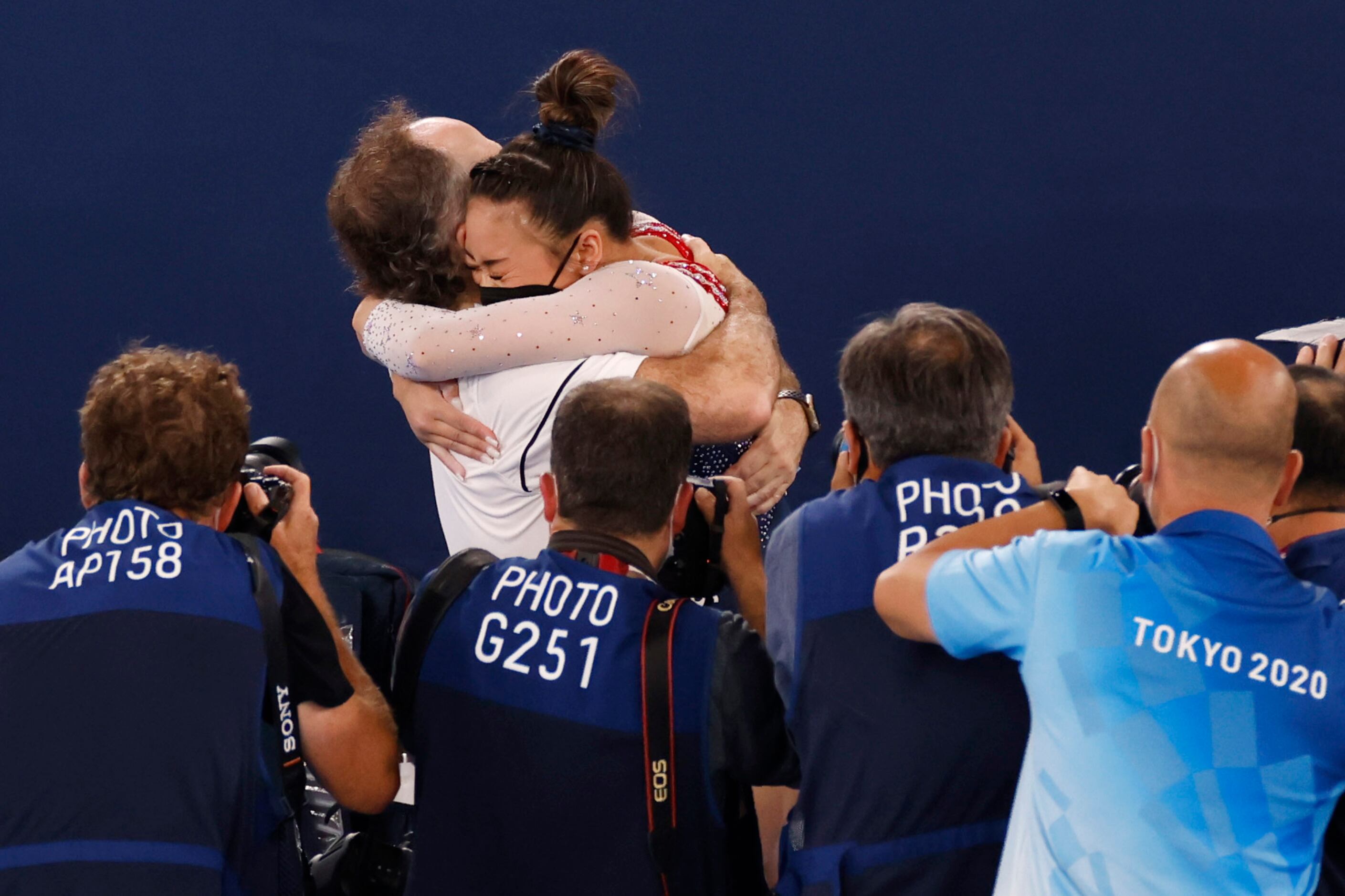USA’s Sunisa Lee hugs her coach Jeff Graba after winning gold in the women’s all-around...