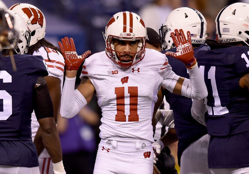 INDIANAPOLIS, IN - DECEMBER 03: Jazz Peavy #11 of the Wisconsin Badgers reacts after making...