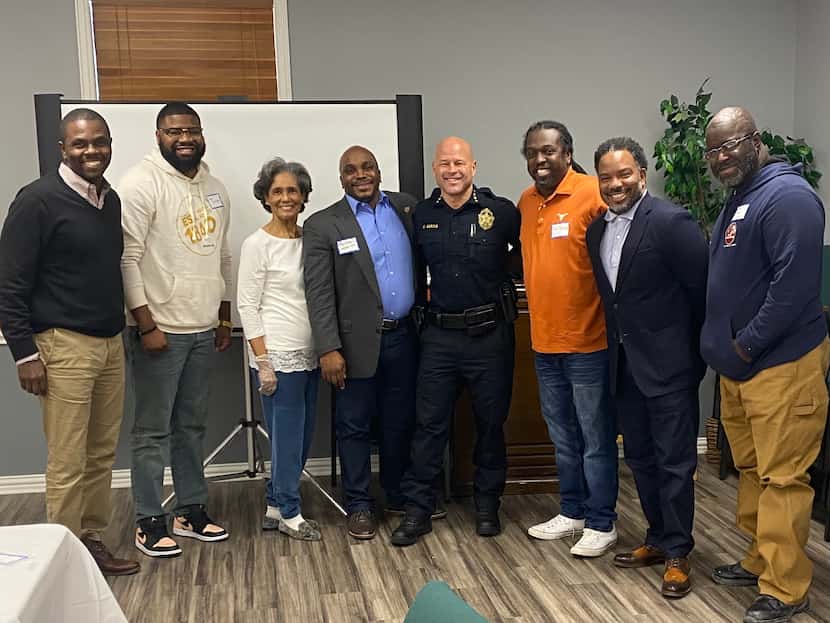 Dallas Police Chief Eddie Garcia, center, with southern Dallas pastors whom he met with Dec....
