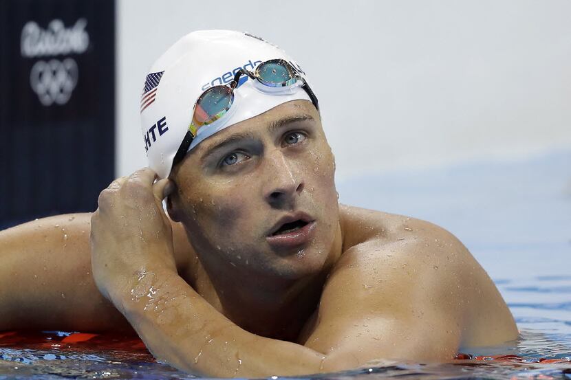 United States' Ryan Lochte checked his time in a men's 4x200-meter freestyle heat during the...