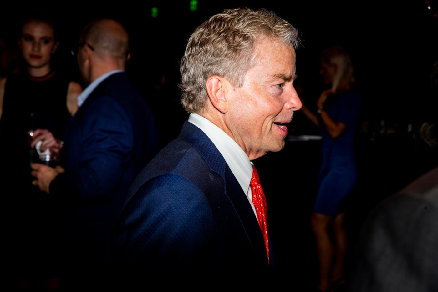 Sen. Don Huffines walks around the room to greet attendants and supporters during a watch...