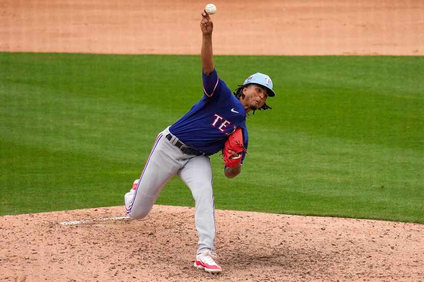 Texas Rangers pitcher Marc Church delivers during the seventh inning of a spring training...