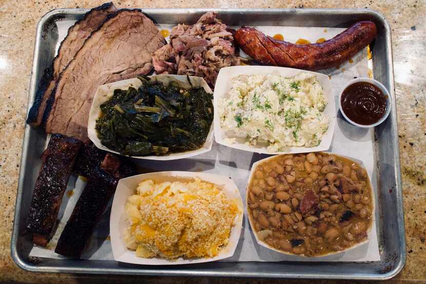 Smoked meat at 42 BBQ Smokehouse + Market can be ordered by the pound or on plates, with...
