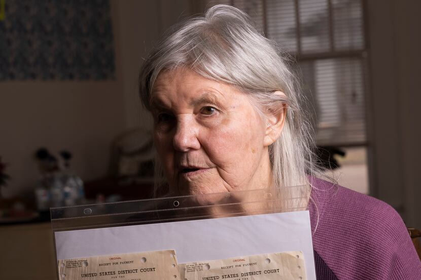 Linda Coffee holds her filing receipts for Roe v. Wade and Doe v. Wade photographed at...