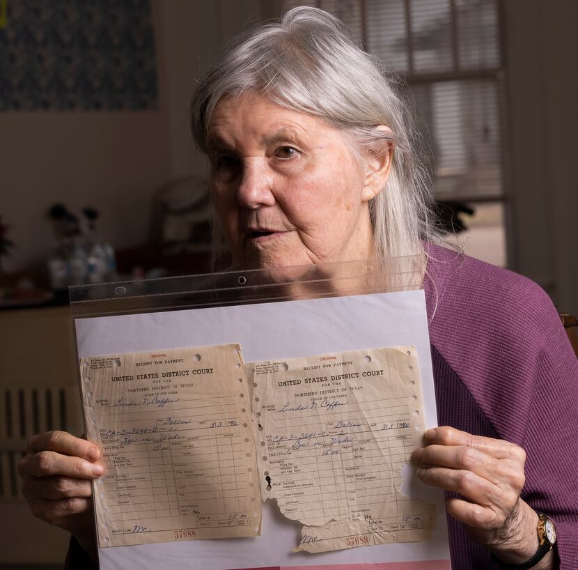 Linda Coffee holds her filing receipts for Roe v. Wade and Doe v. Wade photographed at...