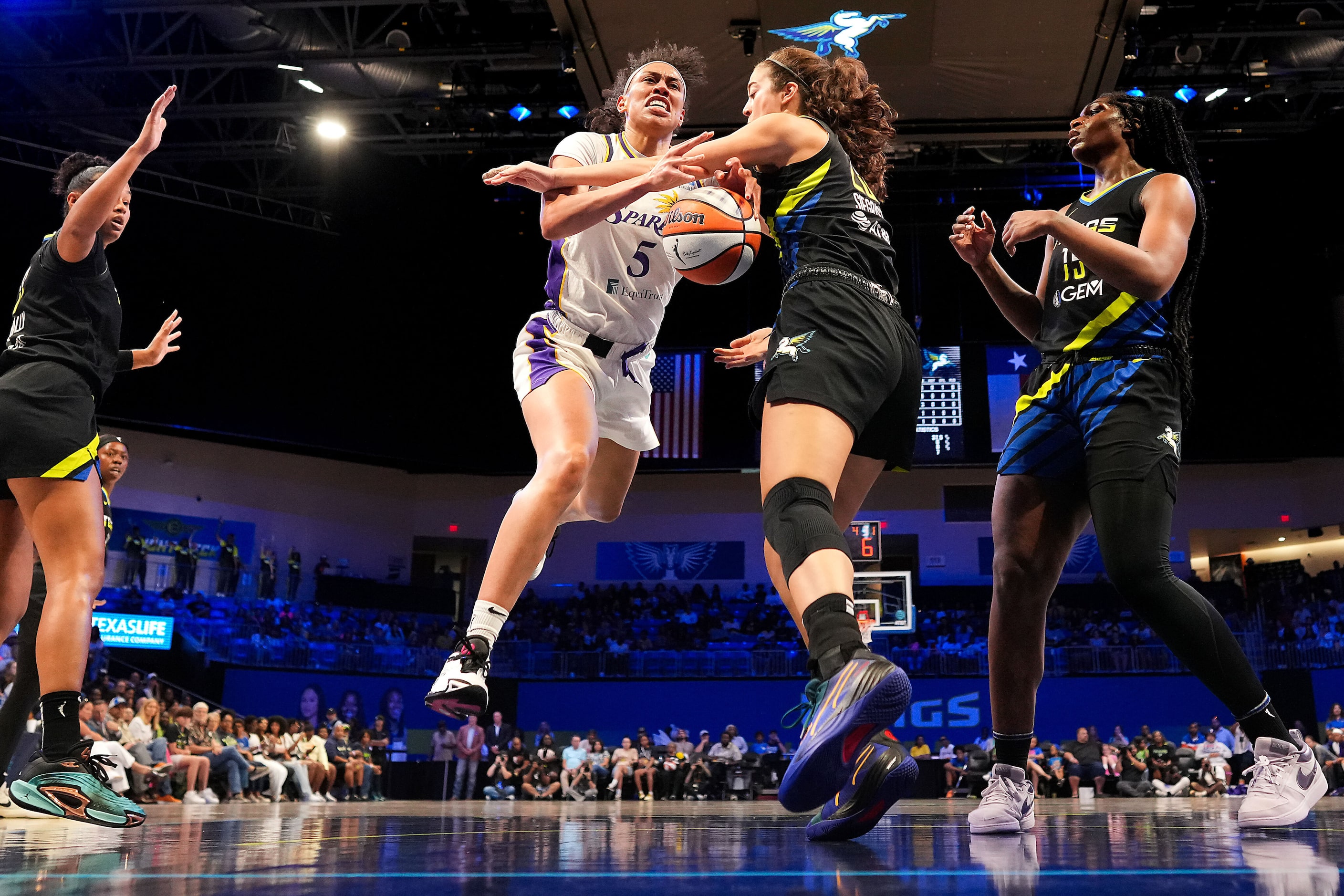 Los Angeles Sparks forward Dearica Hamby (5) is fouled by Dallas Wings forward Maddy...