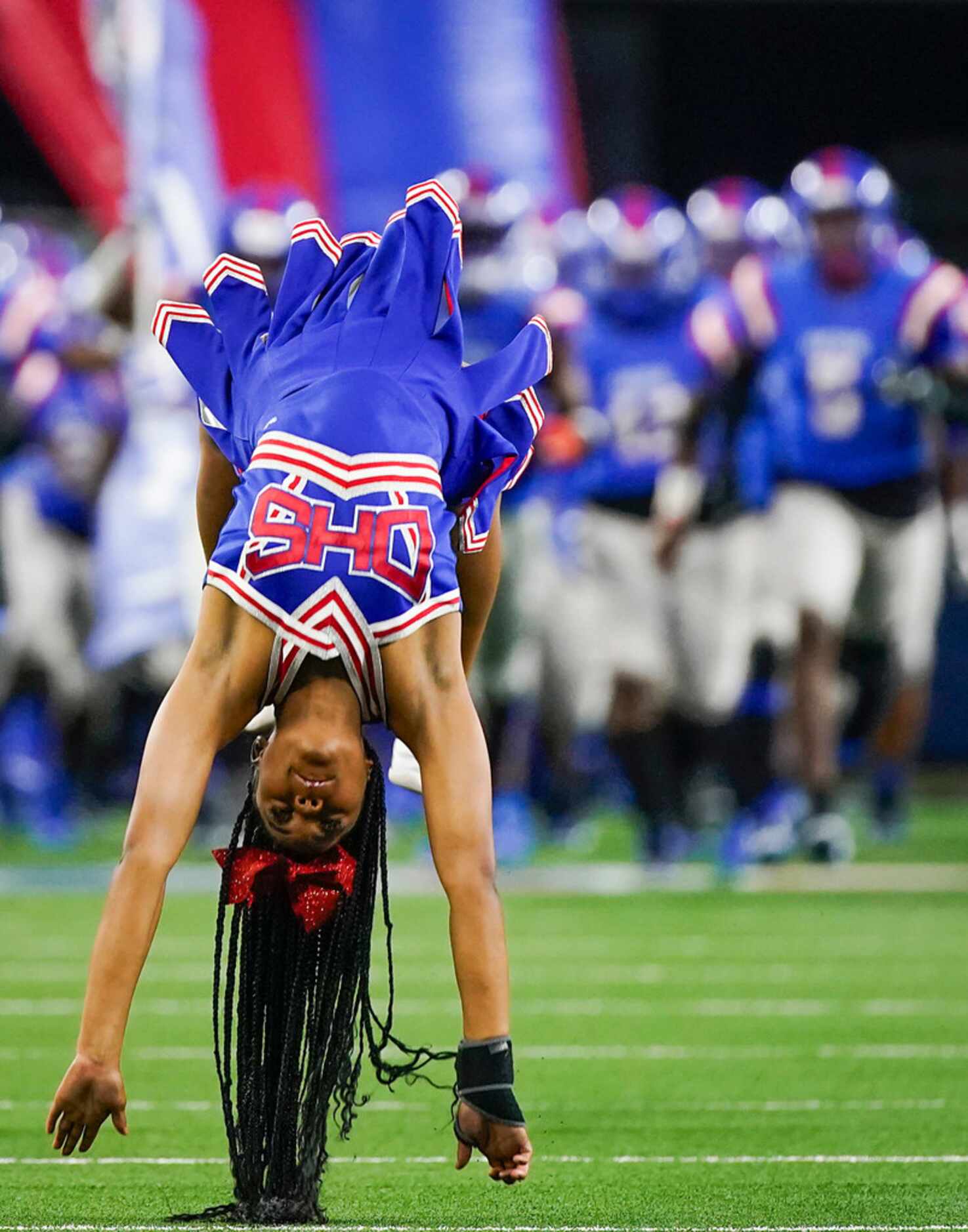 Duncanville cheerleaders lead their team onto the field to face Arlington Martin in a Class...