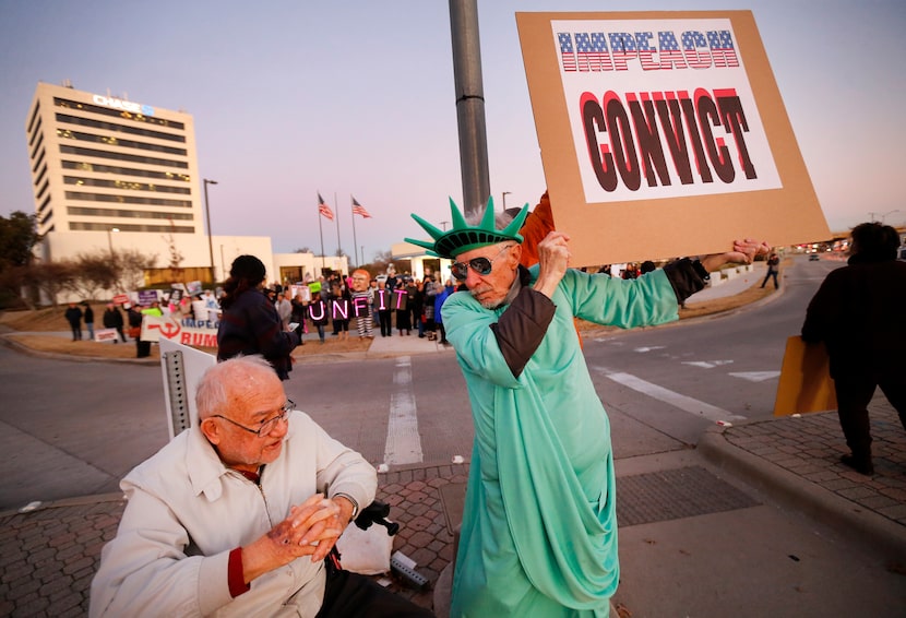 Supporters of U.S. Representative Colin Allred, including Ralph Secketa, 80, (left) and Zen...