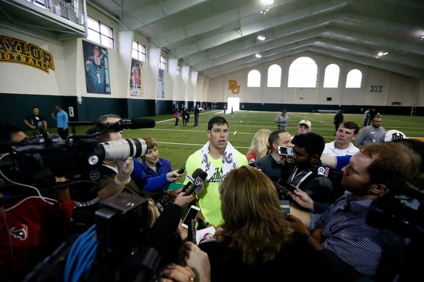Bryce Petty talks with reporters after working out for scouts at Baylor NFL football Pro Day...