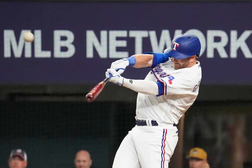 Texas Rangers outfielder Robbie Grossman (4) hits a 3-run home run during the fourth inning...