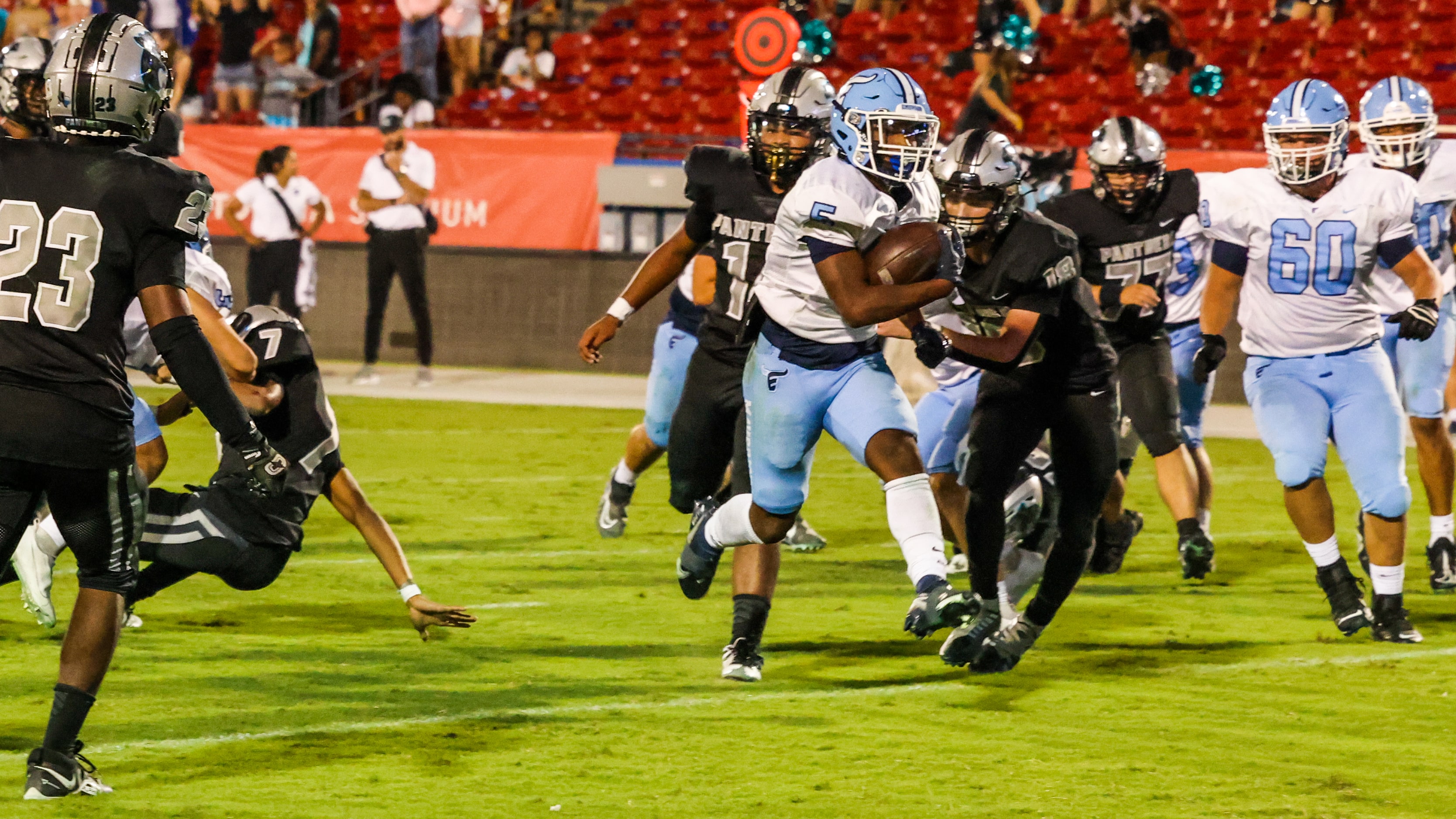 Emerson Mavericks running back Ishaqq Bills (5) rushes into the end zone for a touchdown...