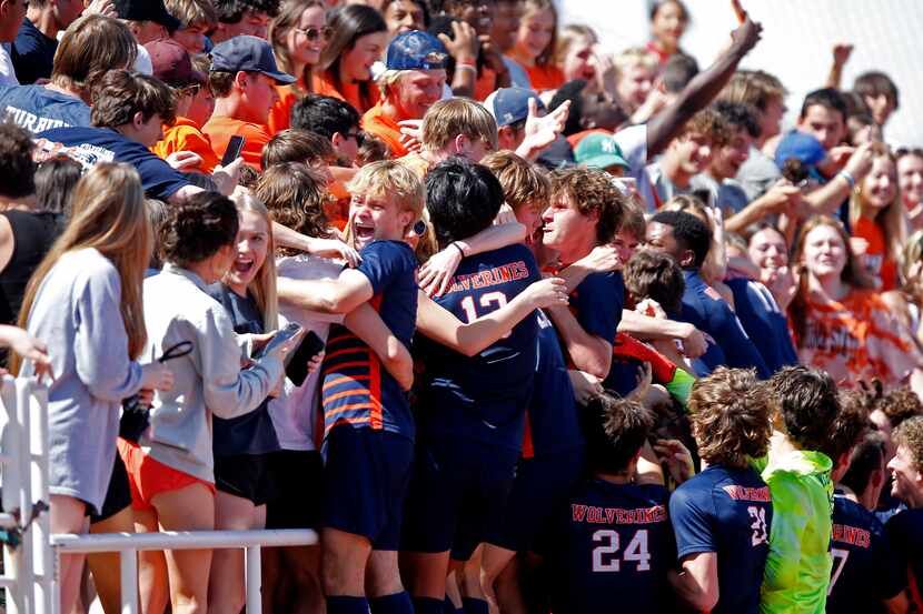 The Wakeland team jumps into the student section after winning the shootout as Wakeland High...