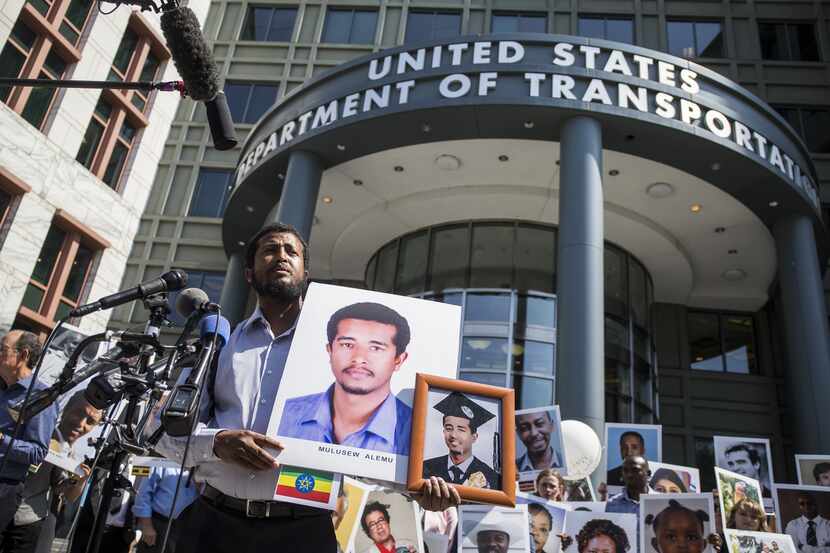 Beza Alemu spoke in Washington, D.C., last month while holding a picture of his brother,...