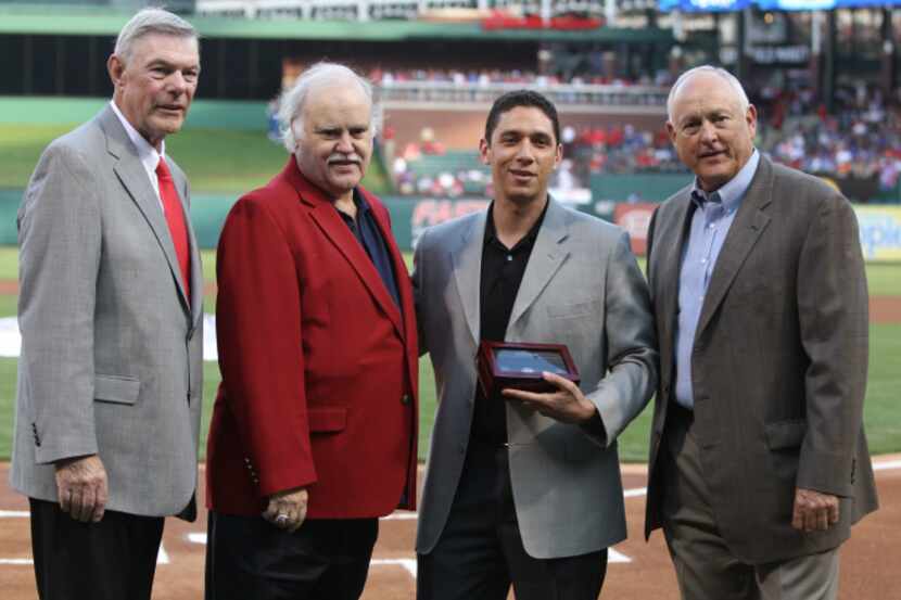 Texas Rangers owners Ray Davis and Bob Simpson are pictured with general manager Jon Daniels...