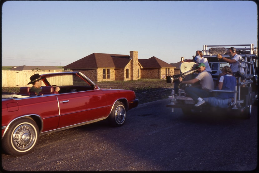 David Byrne drove in his signature maroon 1985 Chrysler LeBaron through the Dorchester Place...