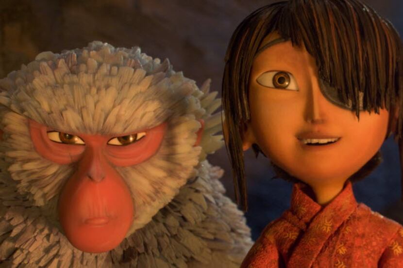 This image released by Focus Features shows characters Kubo, voiced by Art Parkinson, right,...