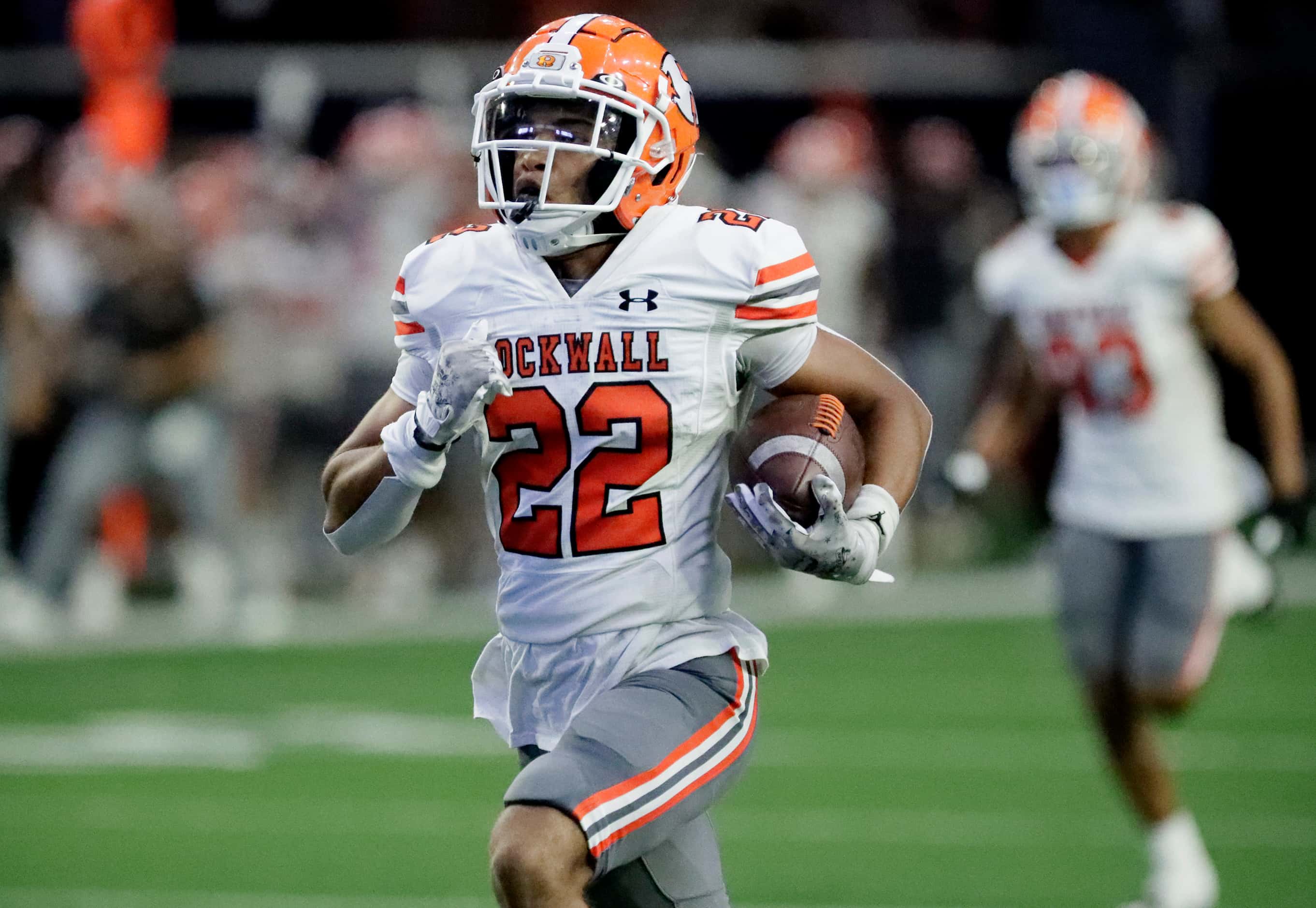 Rockwall High School running back Parker Williams (22) scores a touchdown during the first...