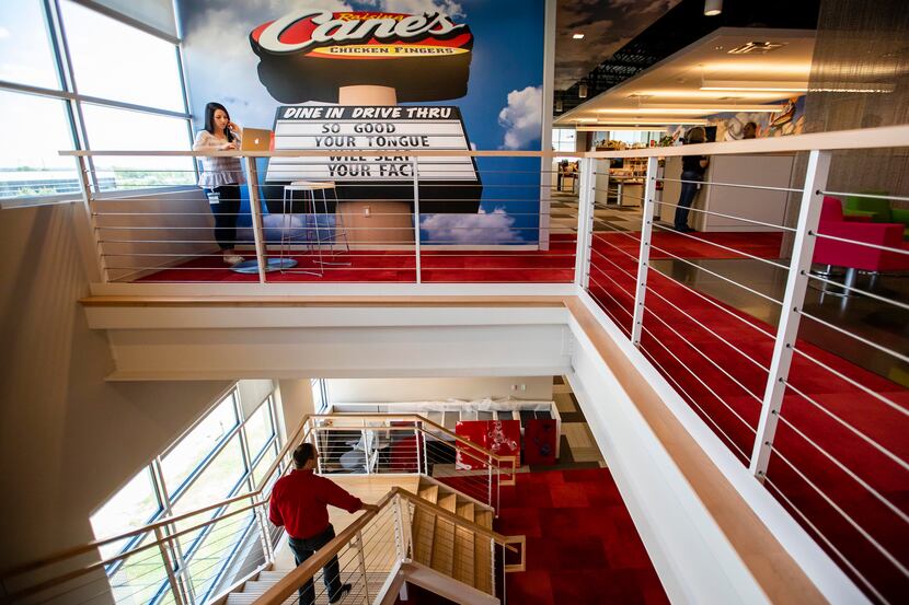 Branding and bright colors highlight Raising Cane's offices in Plano. It's the only company...