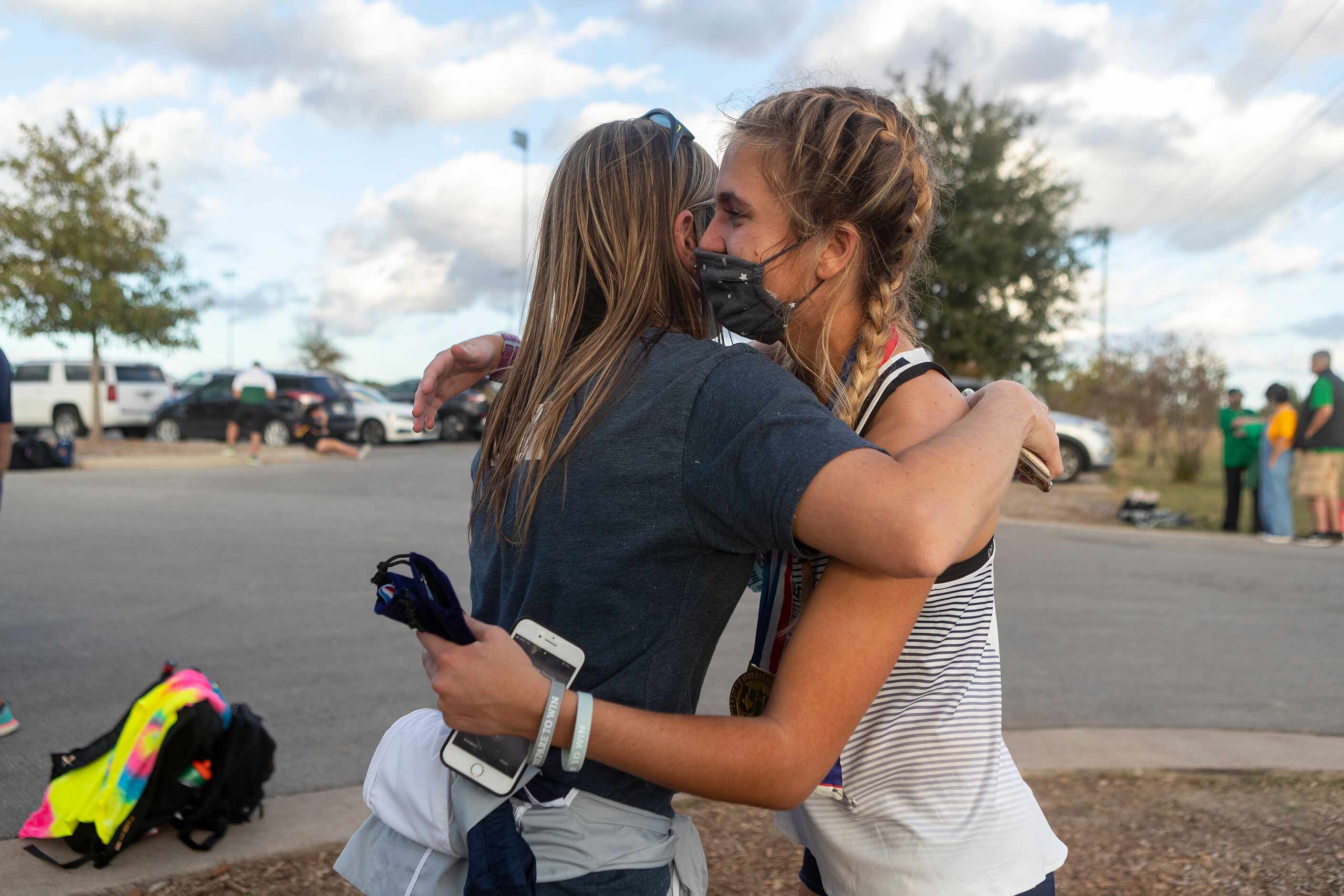 Flower Mound's Natalie Cook embraces her mother Melissa Cook as she celebrates her first...