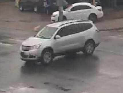 Police are looking for a man who drove away in this Chevrolet Traverse SUV after robbing and...