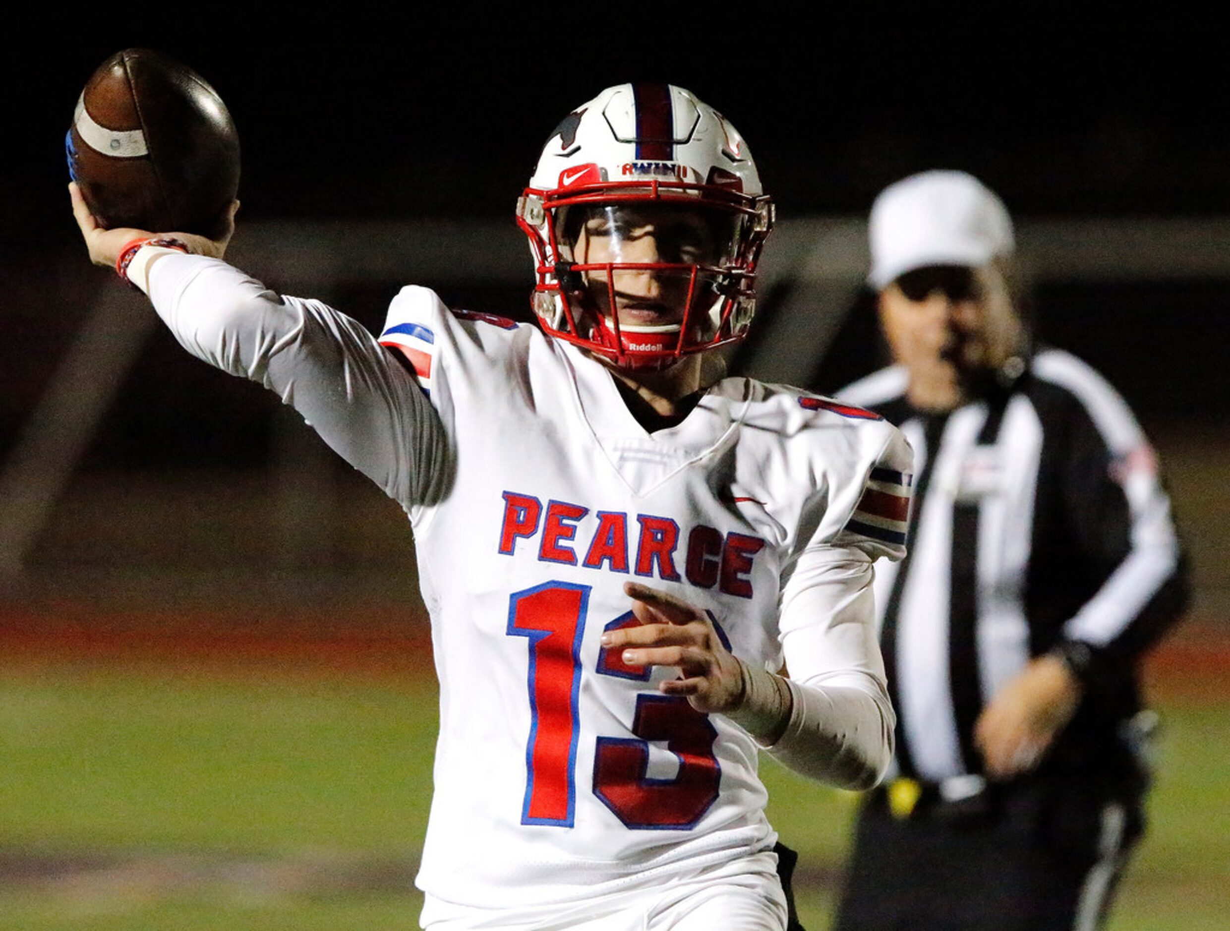 Pearce High School Blake Waters (13) throw a pass on the run during the first half as Cedar...