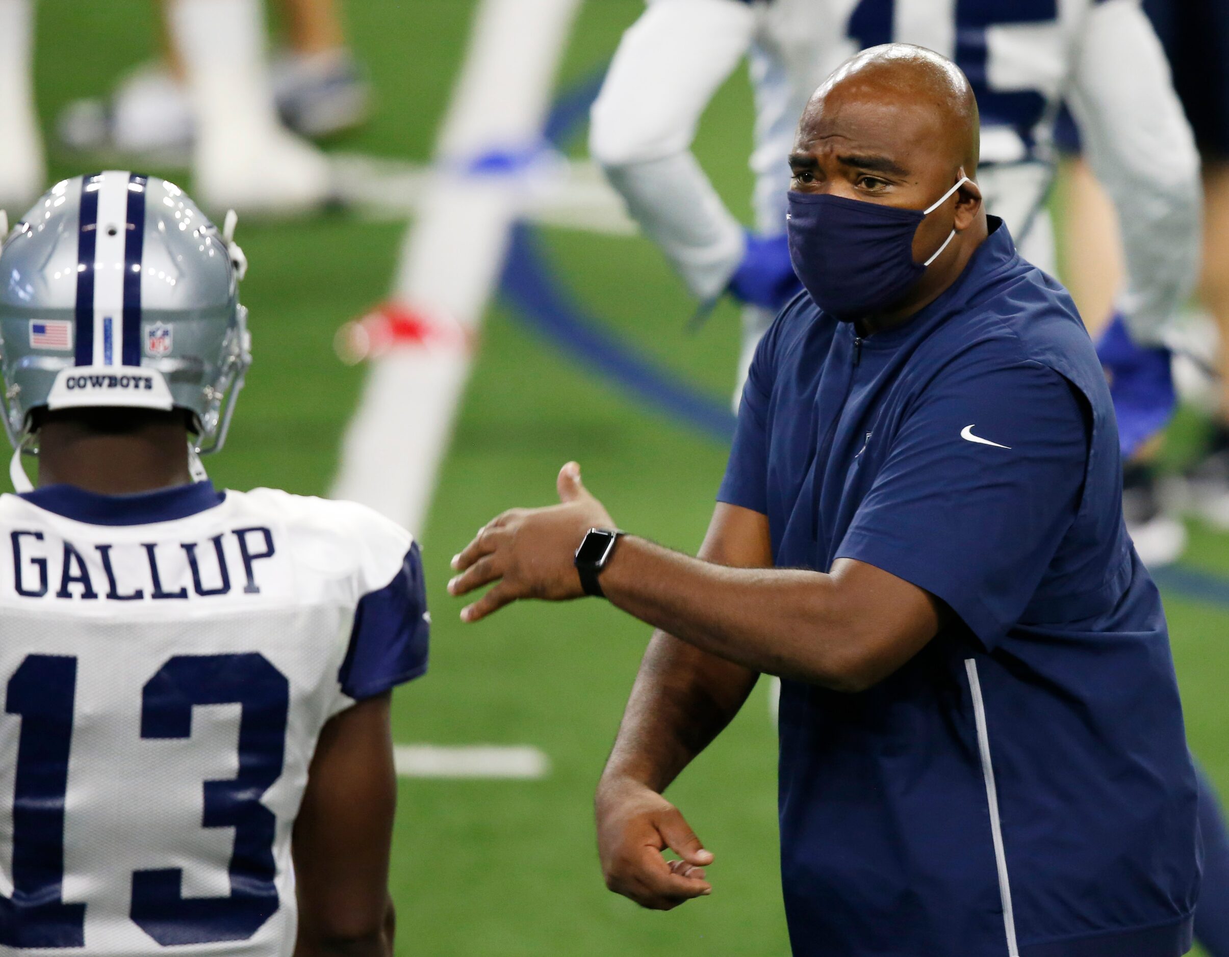 Dallas Cowboys wide receivers coach Adam Henry talks with Dallas Cowboys wide receiver...