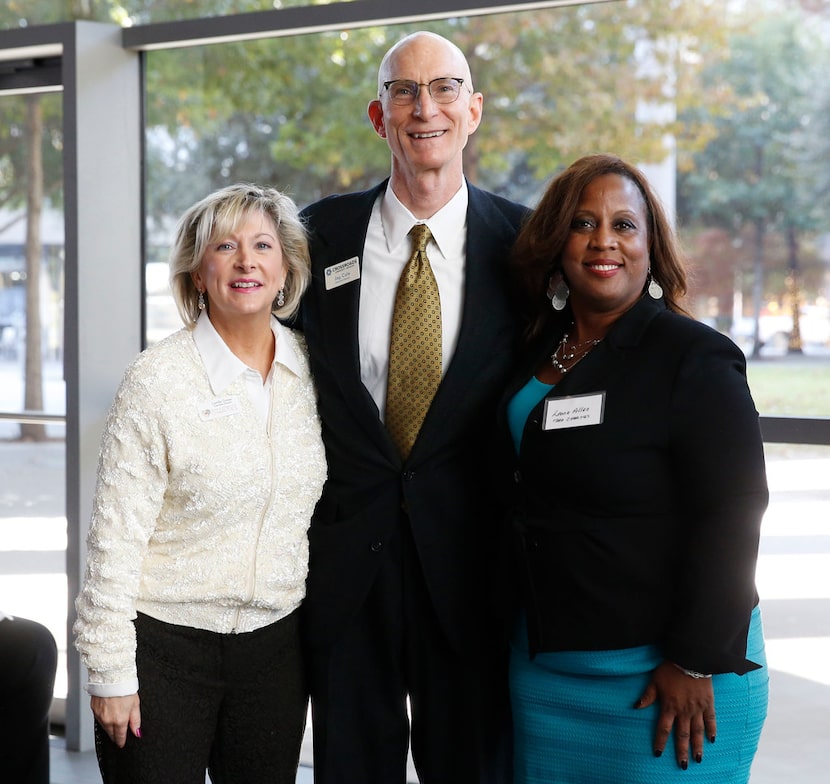 Camille Grimes (from left), the Rev. Jay Cole of Crossroads Community Services and Leona...