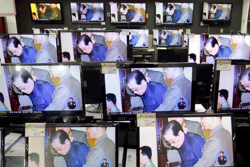 TV screens show a news reporting about the execution of Jang Song Thaek, the uncle of North...