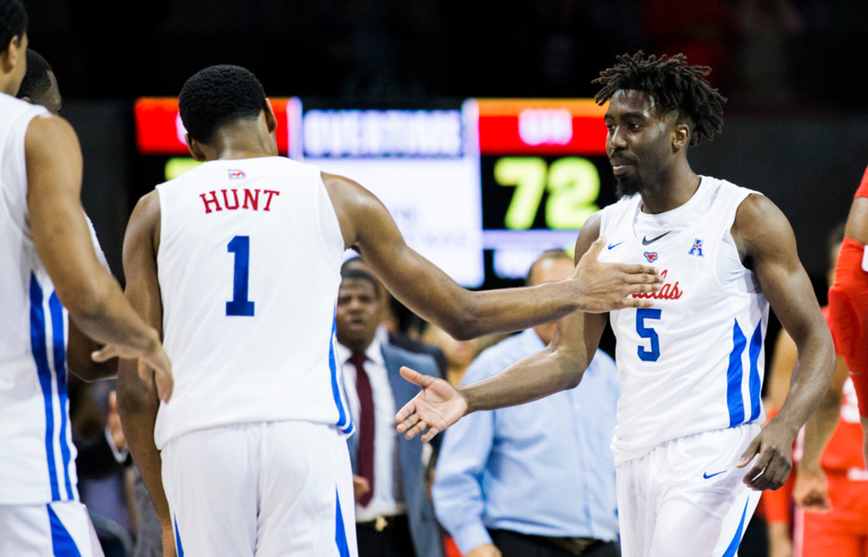 Southern Methodist Mustangs guard Emmanuel Bandoumel (5) gets a high-five from forward Feron...