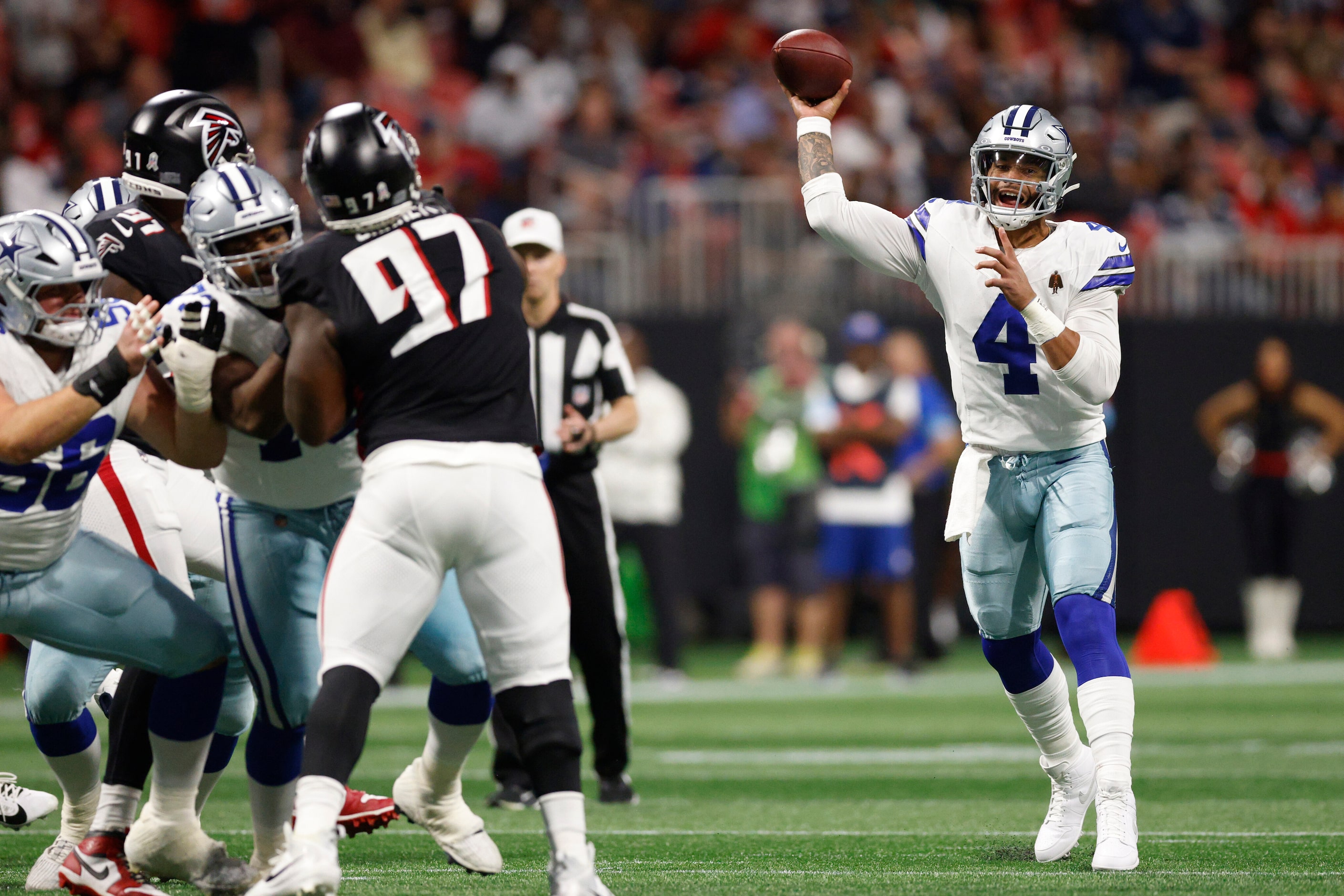 Dallas Cowboys quarterback Dak Prescott (4) throws a pass during the first half against the...