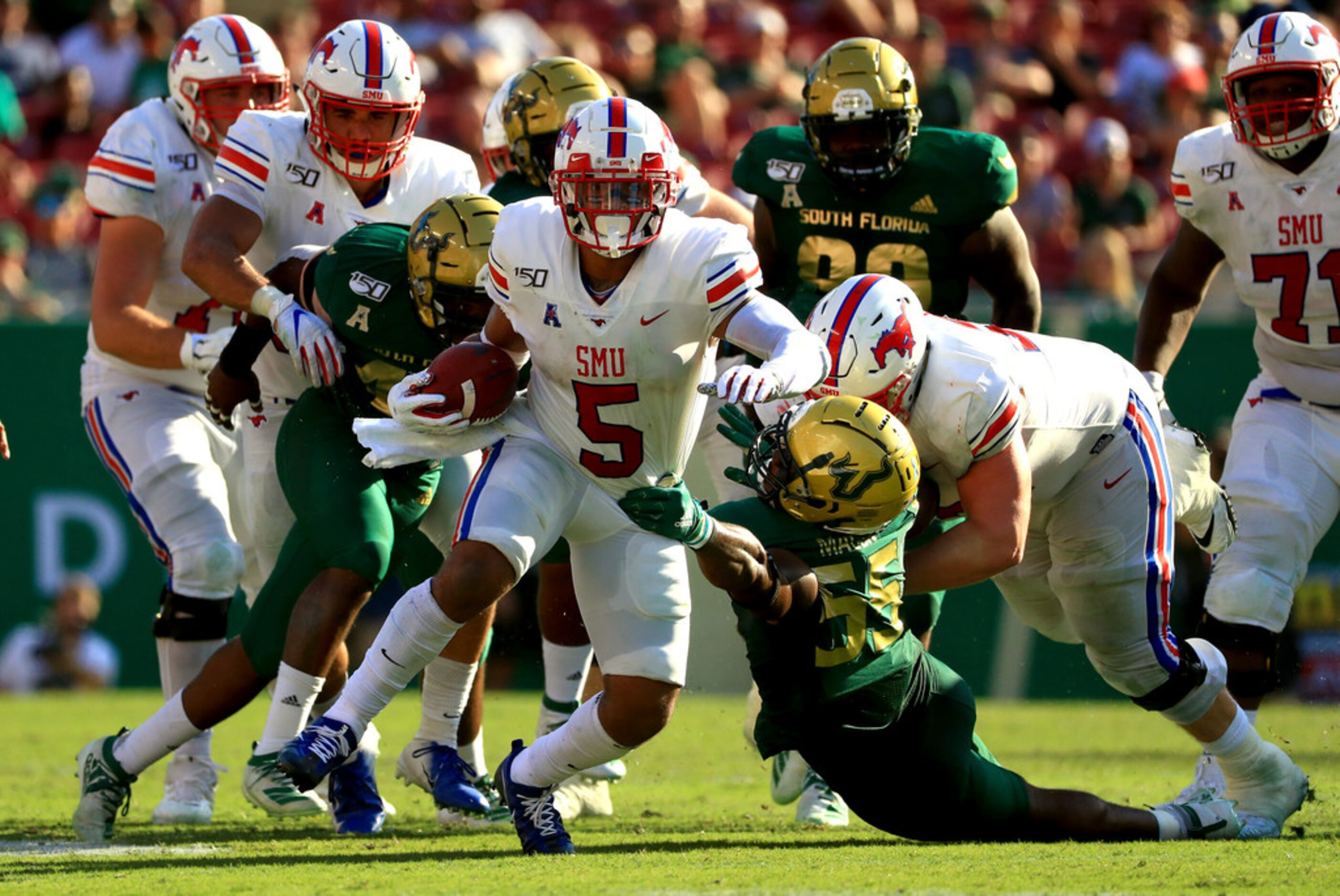 TAMPA, FLORIDA - SEPTEMBER 28: Xavier Jones #5 of the Southern Methodist Mustangs rushes...