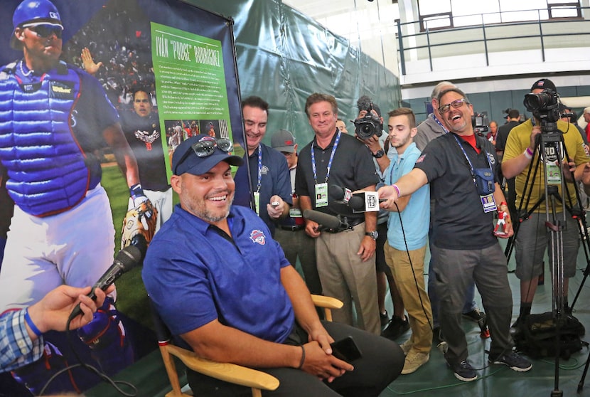 Former Texas Rangers catcher Ivan "Pudge" Rodriguez talks with reporters Saturday in...