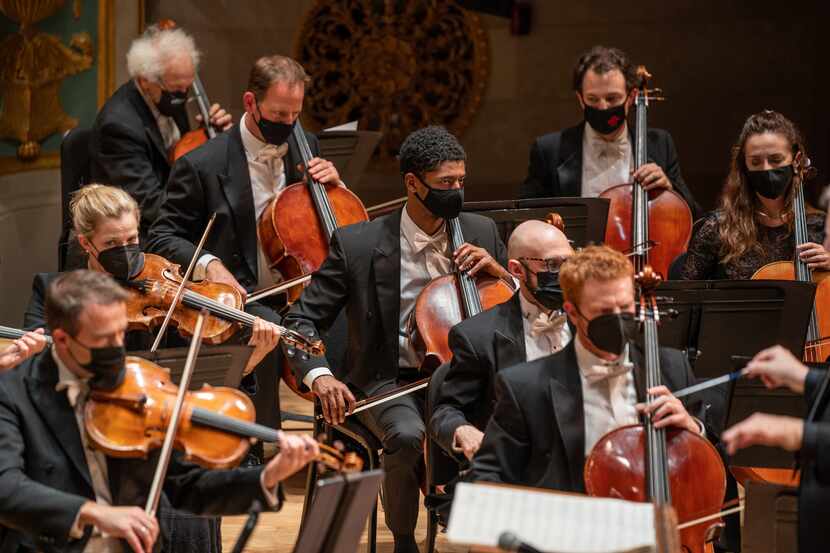 Cole Randolph, middle, plays in the cello section of the Detroit Symphony Orchestra....