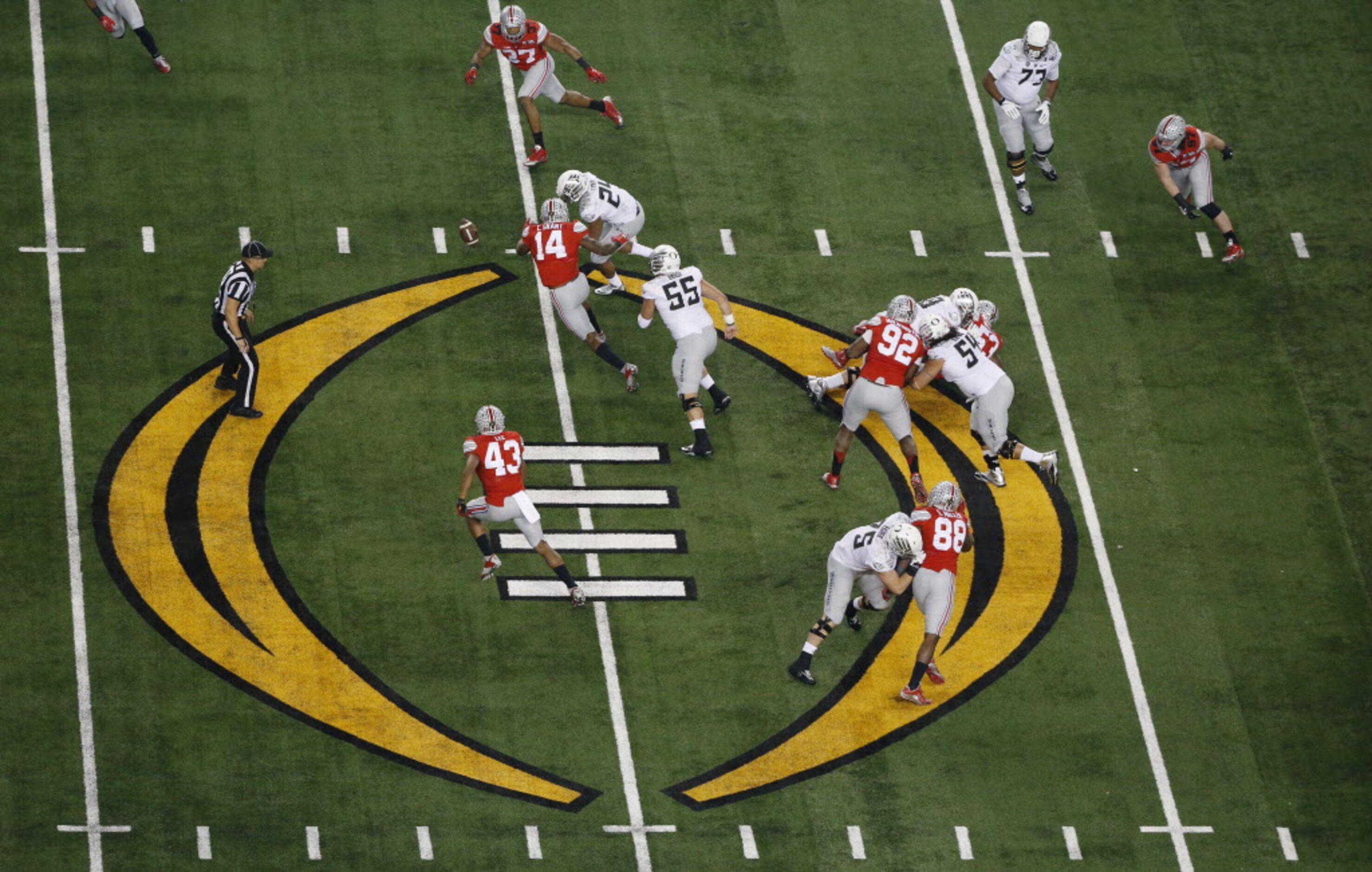 Oregon Ducks running back Thomas Tyner (24) fumbles the ball and then recovers the fumble in...