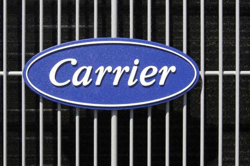 FILE - This April 21, 2009, file photo shows the Carrier logo on an air conditioning unit in...