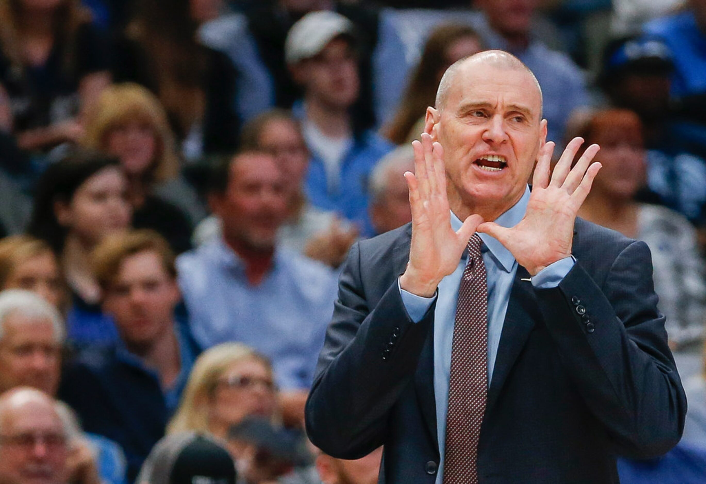 Mavericks coach Rick Carlisle calls out a play during the first quarter of an NBA game...