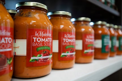 La Madeleine's signature tomato basil soup and other items to take home are sold in La...