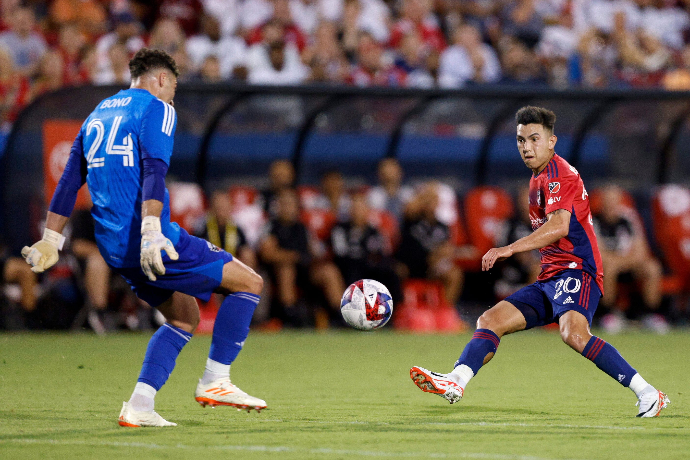 D.C. United goalkeeper Alex Bono (24) blocks a shot attempt from FC Dallas forward Alan...