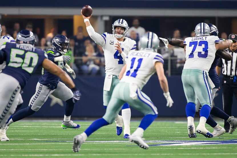 Dallas Cowboys quarterback Dak Prescott (4) throws a pass to wide receiver Cole Beasley (11)...