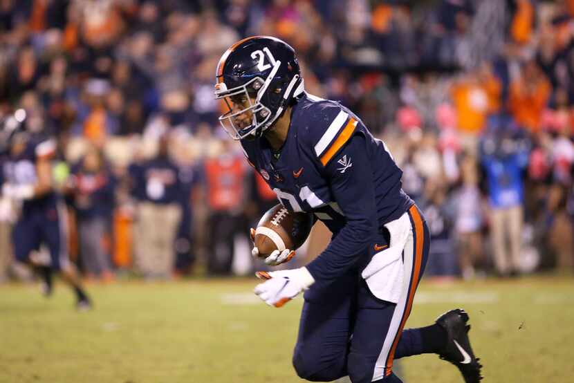 CHARLOTTESVILLE, VA - OCTOBER 13: Juan Thornhill #21 of the Virginia Cavaliers intercepts a...