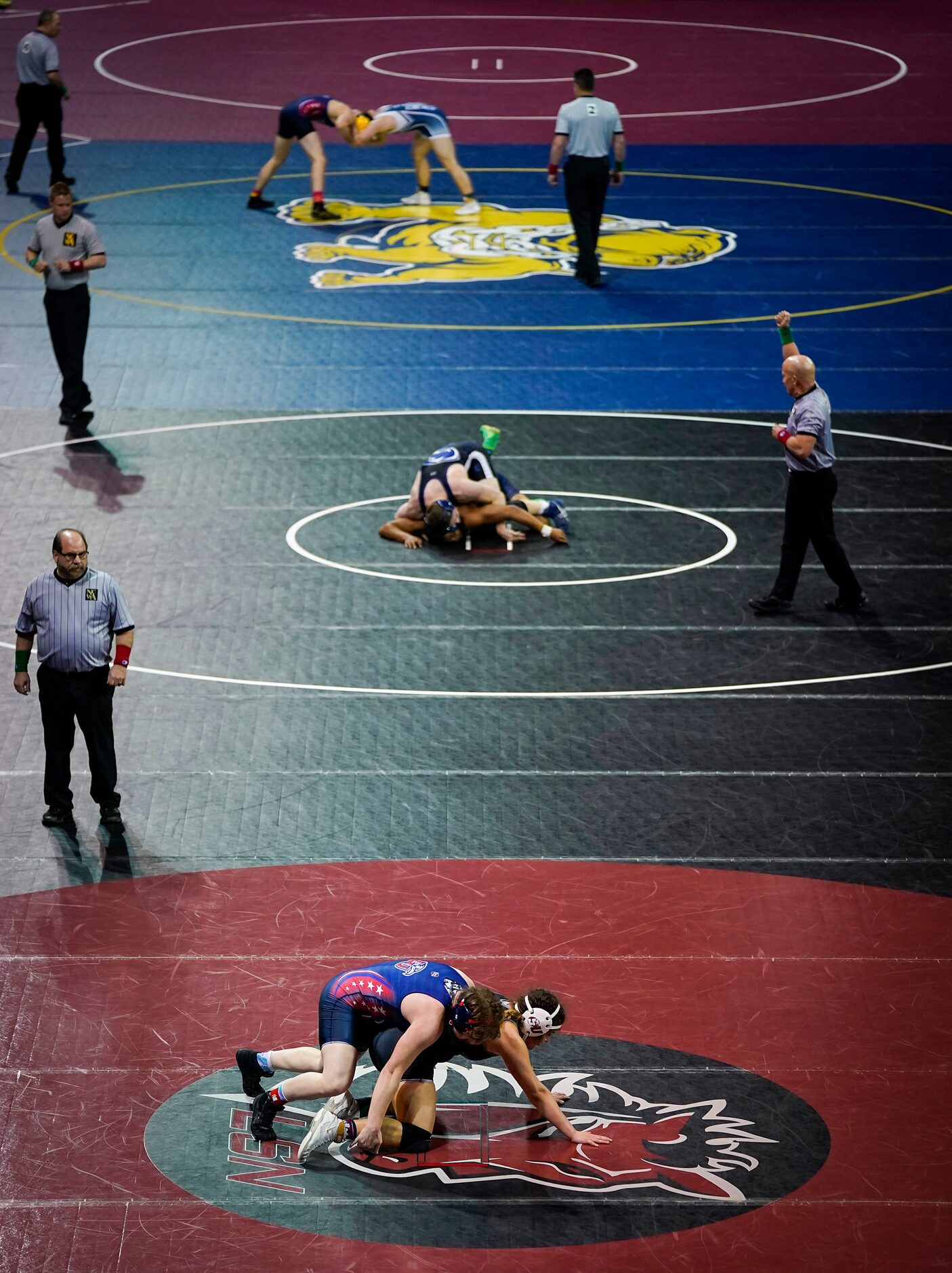 Wresters compete in a consolation round during the NCWA national championships at the Allen...