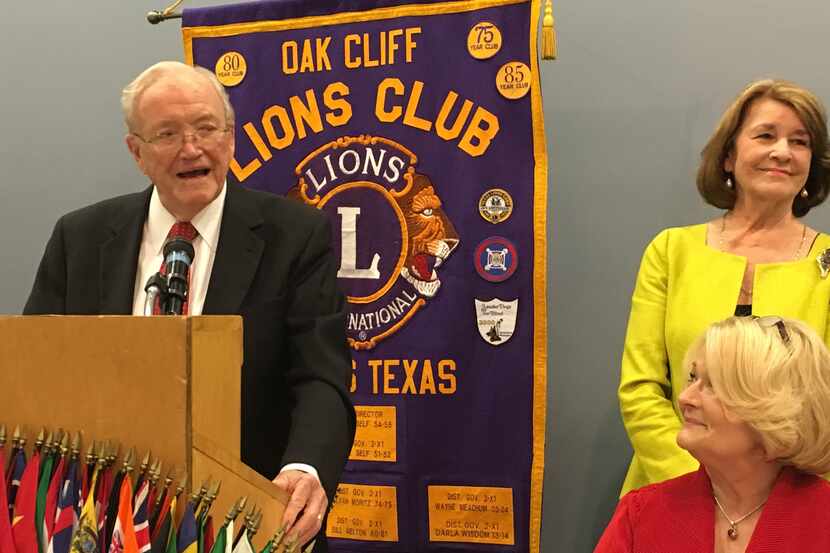 Robert Hyer Thomas addresses members of the Oak Cliff Lions Club while his wife Gail...