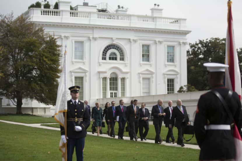 Health insurance executives arrived Wednesday at the White House to meet with Obama...