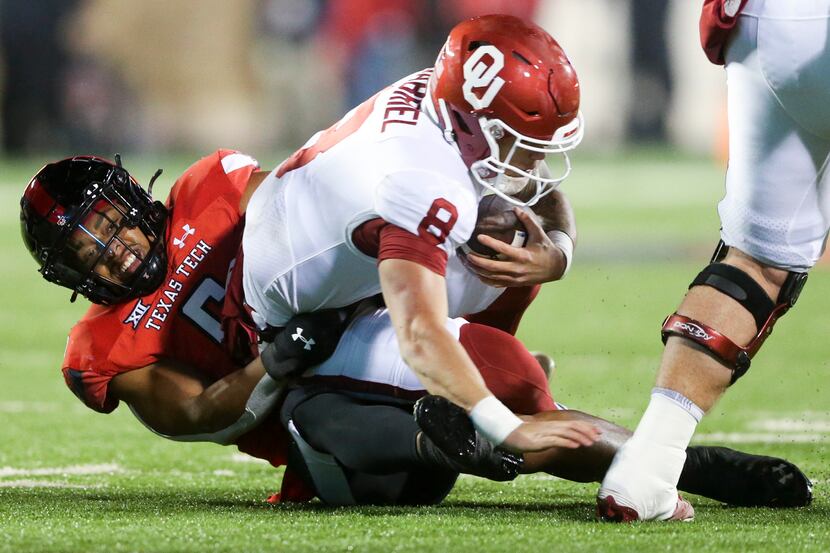 Texas Tech defensive back Kosi Eldridge (6) sacks Oklahoma quarterback Dillon Gabriel (8)...