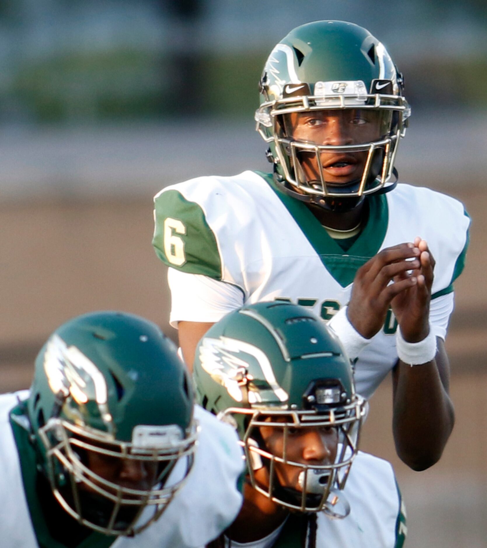 DeSoto quarterback Samari Collier (6) eyes the Jesuit defensive set during first half...