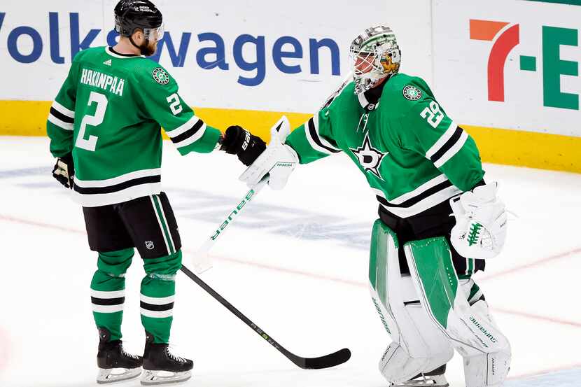 Dallas Stars goaltender Jake Oettinger (29) receives a first bump from teammate Jani...